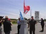 Mark Vandermaas (holding sign) & Merlyn Kinrade (holding UN flag), Douglas Creek Estates, June 19/11